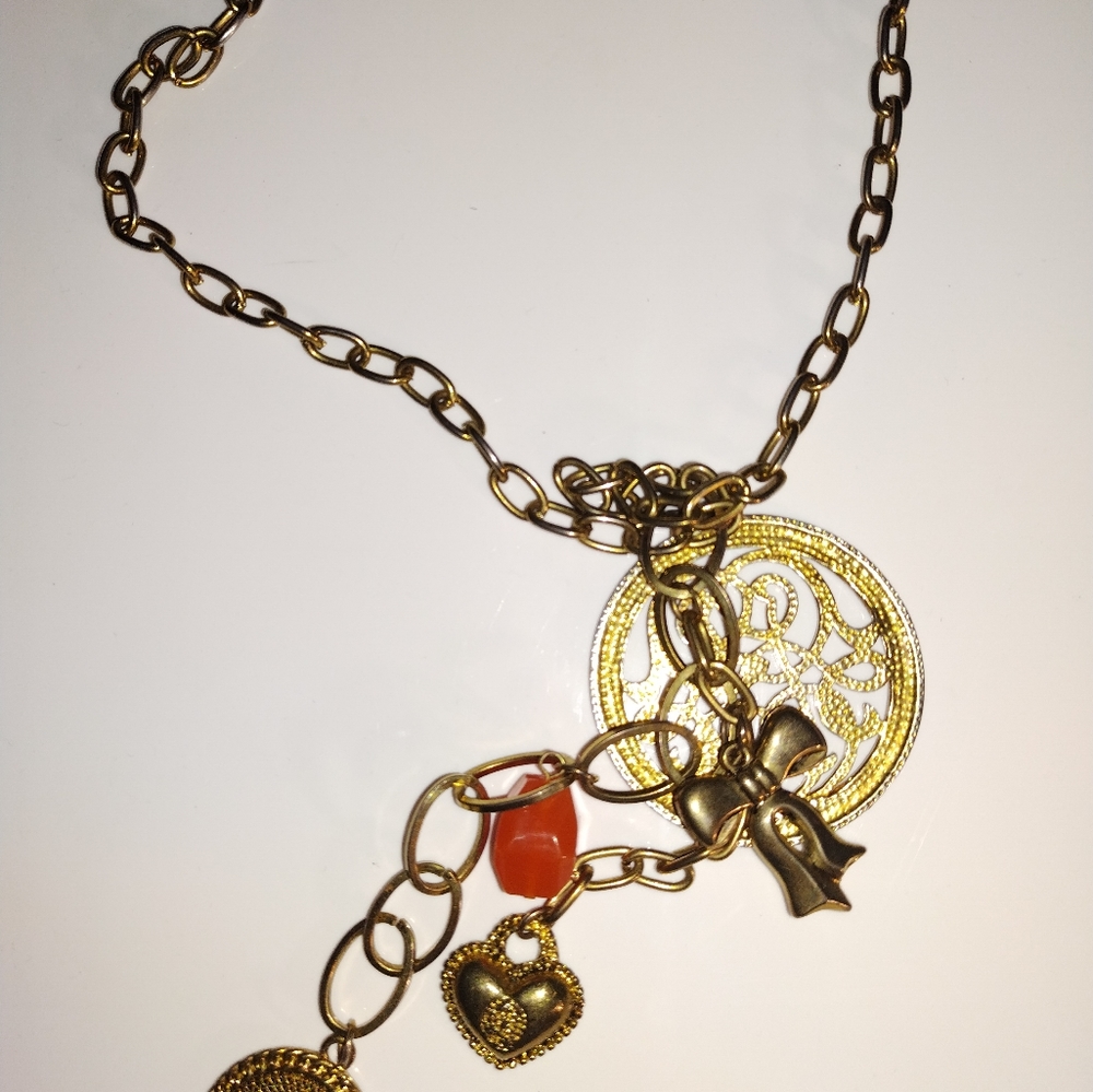 Gold tone charm necklace